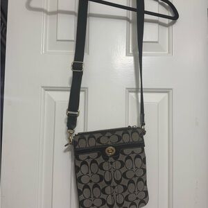 Coach Black Leather Interior with Gold zipper crossbody